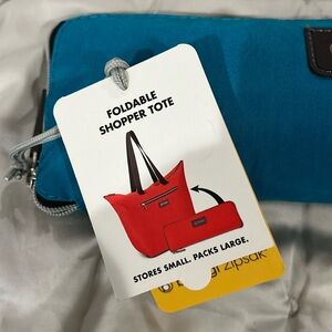 New w/ tags Biaggi Zipsak Shopper Tote. Aqua blue. Durable Nylon. Carry on bag.